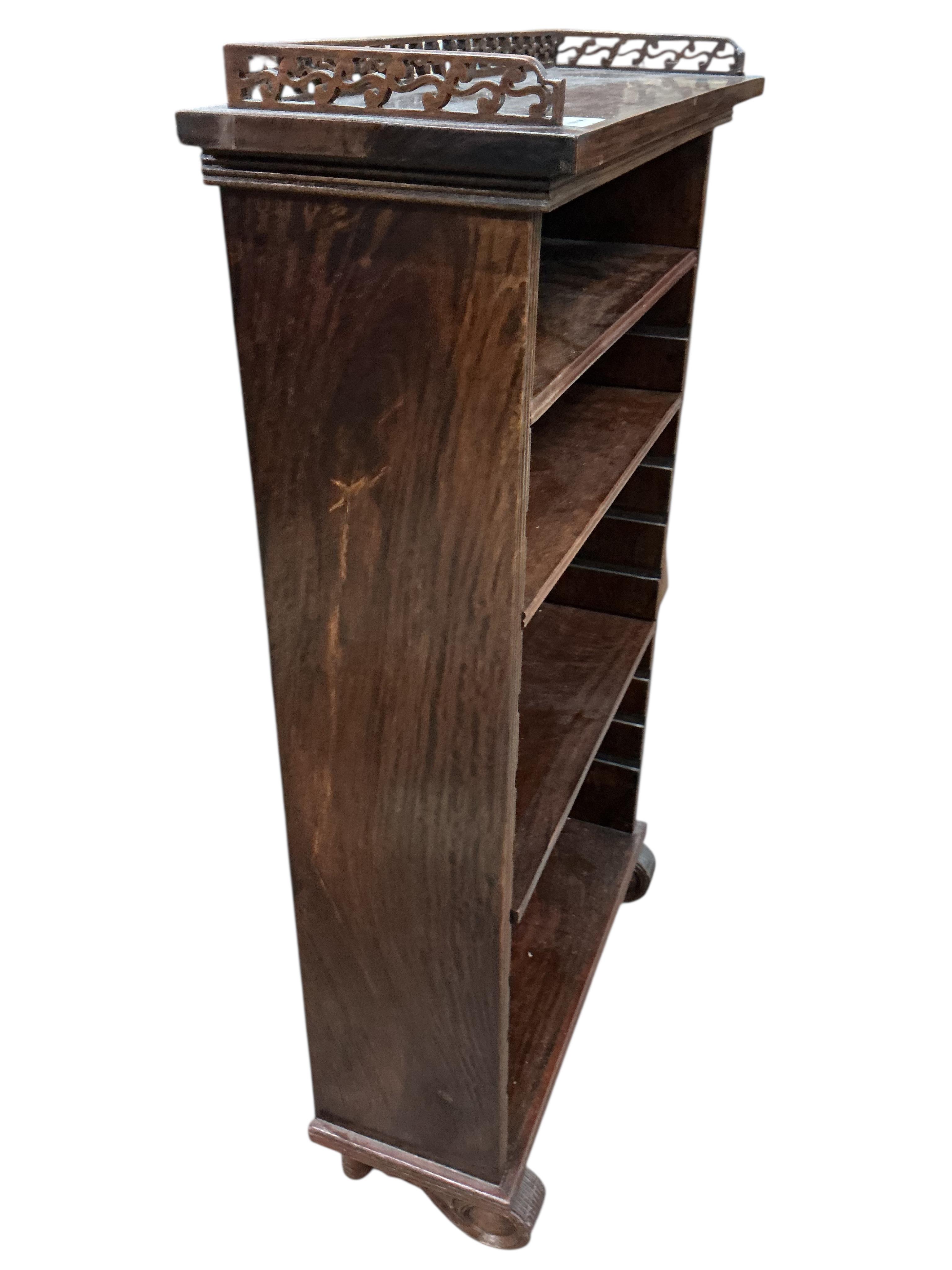 A small reproduction hardwood open bookcase, width 59cm, depth 22cm, height 100cm